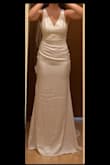I am so disappointed with your lack of quality inspection before shipping the dress. Under 'bright light', this stain appears on the dress, which is hardly visible in natural or modest lighting.

When I first tried it on at home didn't notice any stains and was thrilled with the design, absolutely loved it. Confident in my choice, I stored the dress carefully in the dress bag. However, just a few days before my wedding, I visited an alteration to try sewing a ribbon to the back of the dress. In the bright lighting of the alterations fitting room, I discovered large stain looking like liquid contamination. Rushed to get the dress dry cleaned 3 days before the wedding, and the only thing I can do is cross my fingers.

It is the seller's responsibility to ensure the product has no problem. My venue will be indoors and much brighter than the fitting room so these stains will undoubtedly be noticeable. Unfortunately, I don't have the time to exchange the dress or purchase a new one, so I am forced to wear it as it is. - Yeajin M.