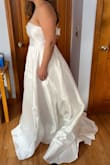 I absolutely love this dress; if I had picked it, I would have removed the bows except for the top one. If you are looking for that classic strapless look for your wedding, this is the one! Super comfortable, pockets and large skirt. - Krystyna K.