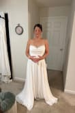 This is my dress! I did order a size larger than I normally wear. I ordered the large (I am usually a medium and wear a size 6 or 8 in everything) and it fits PERFECTLY! Zero alterations needed. This dress was made for me. I can't wait to wear it on my special day. The photo from the front is me trying to control the tears when I put it on and just knew it was the one for me!
It is also amazing quality for the price! Thanks, Lulus - Meredith M.