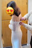This was a dream wedding dress at a fantastic price! I tried both an XS and S, and found the XS worked best for me. No bra needed, but I used Lulus Hollywood Silicone Cover-Ups. The dress was comfortable, fitted, and flattering. The material is not extremely stretchy. With the off-the-shoulder sleeves, I couldn't raise my arms very high but it still worked out fine. - Natalie D.
