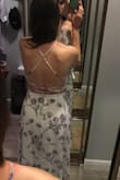 Love the dress simply for being long enough! Planning on wearing flats with it for my wedding rehearsal. Not sure if it's long enough for heels. Only complaint is the top pokes out a little around the chest. Possibly because I don't have enough up there to fill it out?? Also the dress runs a size small. I bought a medium but honestly a large may have been better (besides the filling out the top part). - Amy L.