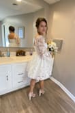 Dress was very beautiful!!! It literally fit me perfectly. I had a small wedding and was nervous I wouldn't find something in my price range that still made me feel like a bride. This dress made me feel so beautiful. The material is not stretchy.. if I was 1 inch bigger, it wouldn't of zipped. But everything about it worked perfectly for me! - Chelsey W.