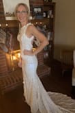 I have been looking for a dress for our elopement and wanted one that would pack nicely and be classy but not too over the top. This dress met all my expectations and was perfect for me. It is not stretchy but fits and hugs all the curves like I had hoped. I can't wait to wear it on the beach! - Amanda O.