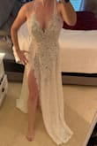 Bought this for a beach wedding. Fits true to size but does run long. I'm 5'4 and have a couple extra inches of extra fabric that could be hemmed (although I probably won't). Comfortable too! - Sara T.