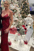 I don't usually wear red, but I needed a red dress for a Christmas Gala event. This dress was beautiful and just the right shade of red. Not too bright and the flowers really added a nice element. The dress was very comfortable and easy to move in. I received many compliments and would definitely wear this dress again. - Samantha G.