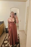 Wore this for a wedding and got a lot of compliments! I loved the details on the back and the slit really made the dress that much better. Highly recommend this dress! I got my usual size in dresses lately which is a Large and it fit well, was a little tight trying to connect the back but wouldn't have gone a size bigger. It's a very pretty mauve color, just like the photos shown on the site. - Kinnidi S.