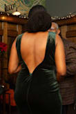 I didn't know how the dress would fit because I'm pear shaped and have a smaller chest than hips, but everything fit perfectly. I didn't need to get it tailored at all. The back has a unique piping that holds the shape of the open back. There is no zipper. The dress is a stretchy material similar to a body con dress.
I wore an adhesive bra and was fine all night. The dress comes down to my knees. I'm 5'10" with a 35" inseam for legs. - Sheri S.