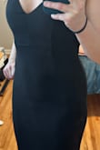This is a great basic black dress. It's classy and has a beautiful mermaid shape. And it's long enough for me to wear heels with! Wrinkle free, and stretchy! I only gave it 4 stars because the material is pretty unforgiving. (See photo) I'll have to wear shapewear with it because it shows every detail of my midsection. But that is probably just what you get with a more cost effective dress. Overall I would recommend this one! - Megan D.