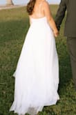 This dress was perfect for the price. My husband and I eloped and I needed a cheap yet cute dress! It only took about 1.5 weeks to arrive.

There are 3 layers to the dress, the bottom is a satin layer, the middle is a lace layer, and the top is a tulle layer. You will need to steam each layer to flatten them out!

I am short and this dress was super long on me. I had a friend hem this dress to the correct length. (We took off about 5-6 in of the tulle layer) 

The straps were super long. We also had to cut and sew these to a shorter length since there are no adjusters on it. 

Dress is very comfortable and looks fantastic! - Mackenzie H.