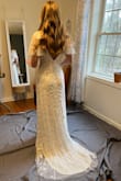 Absolutely love this dress! Looks just like the photos and the beading is stunning. I ordered a medium and it fit me perfectly. Highly recommend as a bride on a budget. - Jeremy M.