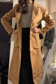 I love the look of this coat! I am a very tiny person, so oversized coats can look ridiculous on me, but I think this one (I purchased in XXS) is on the right side of oversized that it looks fashionable rather than like a child playing dress-up in dad's coat. However, it is nowhere near as heavy as some of my other dress coats, and I knew right away as I picked it up still in its dust bag that it was very light weight. Definitely more of a fall/spring coat rather than something I would normally choose to wear in sub-32 degree northeastern temps. It's roomy enough that I could comfortably layer underneath (I normally wear a sweater and a suit blazer) so I may still get use out of it this winter. - Emily K.