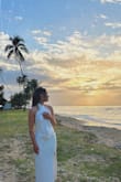 Make sure you put it on right, I notice a lot of people put this on wrong and think it doesn't fit, but really it fits like a glove!! I wore it on vacation and it ended up being the dress I got engaged in! Looked so beautiful and classy. LOVE!!!! Also I ordered this when I was a true size 6-8 and it still fit me after I lost weight at a size 4. I wouldn't say it's stretchy but there is room to gain and lose. - Carissa C.