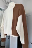 Obsessed with the colorblock style, can easily be dressed up or down. Unfortunately, the one I received has a section of loose unstitched threads on the shoulder, so I'll have to ask about that. But otherwise, it's beautiful. - Walesia R.