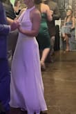 I wore this dress for my wedding reception and absolutely loved it! The style is stunning, but the fit was very large on me, despite ordering the XS. The halter at the neck was way too long and had to be taken in a lot, and the bodice was rather loose. Still love this dress, and if you are willing to alter it, I'd definitely recommend! - Elizabeth H.