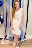 THIS DRESS! One of my all-time favorites. Wore this dress for my bridal shower and it was perfect! It is absolutely adorable, fits true to size, and is comfortable to move around in and sit in despite the stiffer material. The bow does have to be double knotted to stay, but this dress was also such a crowd pleaser! Highly recommend if it is a style you are considering. - Elizabeth H.