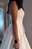 It's a nice dress but it just wasn't the "one". The cups are molded so it gives you a nice shape. I wasn't a huge fan of the embroidery but that's a personal preference. - Rosie R.