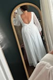 The dress was beautiful and high quality. I purchased this for my wedding but couldn't zip the full way up with a 40" band size. I am a true 40DD and there was absolutely no way anything bigger than a B cup was fitting in this. The shoulder to waist ratio was not correct and definitely needs to be modified for longer bodies. Beautiful overall just not the right fit. - Kalynn S.
