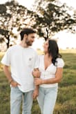 I wore this for a photoshoot when my husband proposed to me & it was perfect! We were going for a country/nature aesthetic with blue jeans and white tops and this blouse went perfectly. It's not too cropped to show the stomach but falls right at the waist. - Shelbie W.
