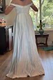 Looking for a budget friendly wedding dress, and this was not the one, the front piece over the chest is loose and sits weird, needs to be sewed and the dress was not the best material - Caitlin K.