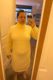 I really wanted this to be great, but it just didn't work for me. I'm 5ft 4in, which is just on the edge of petite sizing, but my bust is a 34I. This pulled over my bust and my belly, and it really just sort of overwhelmed my figure with how much fabric there is. The hem came to my mid-calf and the turtleneck was way too stiff for how high it came. Surprisingly the sleeve length was good though. - Taylor D.