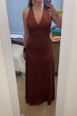 I think if the style of dress that fits you best is a "business in the front-party in the back" then this dress is for you, but it was just not doing it for me. Felt a bit bland/simple/unstructured in the front. The color is a nice like rusty mocha. I'm 5'4" and it was floor length and the criss-cross straps in the back were a bit too long. - Andrea R.