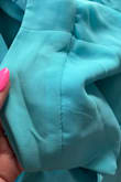 I received this dress and was so excited to put it on. I tried it on and noticed in multiple areas black stains. I also noticed multiple seams coming loose. This really disappointed me. The size is overall good but the waist is a little large. I am returning it and hoping the next one I receive will be better made. - Sheri L.