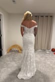 The roses are stunning. The arms are way tight. So there is very minimal movement if you want to lift up your arms due to the off-the-shoulder part being tight. It's also a very white dress, probably the whitest I tried on! - Ariel B.