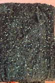 The dress is very pretty, the material does have some give to it, and would recommend sizing down. However, other than trying it on when it came in it's hung in my closet and there's a large section of sequins that are just missing. My return window has closed otherwise I would return the dress. - Shawna W.
