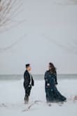 The dress was absolutely perfect for our engagement shoot, even with the snow falling around us. It fit beautifully, looked stunning in the winter setting, and made me feel so elegant and confident. I couldn't have asked for a better choice! - Bluma M.