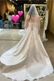 This dress blew me away. It's just like the 2-3k dresses I tried on! It looked amazing on. The pictures don't do it justice, partially because it needed some steaming. But it was light and simple but just enough structured. You could dance in this easily. I ended up picking a different style of dress, but man this is a great option if it's the style you're looking for. The top was structured in the bust area and everything. If you wanted to add buttons down the back, that would be really easy to do.

If you're confused by the pictures, I brought the dress with me to a store to compare it to some high end dresses and it stood up! - Samantha S.