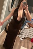 The dress looks just like the pictures and the other reviews. The size robot told me I'm a large, but the large is too big. The medium fit perfectly.  I'm a 29 in jeans and an 8 in yogas/ dress pants. The brown dress is a size large and you can see it. It's big in the back. The red dress is a medium. It does hug your curves so if you don't want something that highlights your belly from the side, this might not be for you. The larger the dress was the longer the front hung down as well. - Katie O.