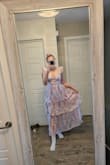 Dress is just as pictured! Fits true to size too. Definitely recommend! - Linda A.