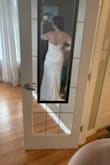 Beautiful dress! The bodice has no give to it and can be a little tight so be careful with sizing, especially if you have a larger bust/rib cage. I'm 4.11 and wearing 4 inch heels and will need to get the length hemmed. Excited to wear it for my upcoming elopement! - Lawren F.