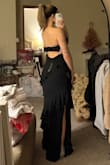 I almost ordered a Medium but I'm glad I trusted my gut and got a small. The dress itself fits well, and the bust area is not too large. I am literally an A cup. The dress is flattering in the stomach area as well.  These photos were taken right before I moved so excuse the mess - Hannah B.