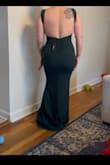 The fit is amazing. I recently had a tummy tuck and wanted to show off my new curves with this beautiful dress. It hugs all the right places. I haven't worn to the wedding yet but I have tried on. I definitely love the dress, I can see where the sleeves will be a little annoying but for one evening it will work. Definitely buy boobie tape, maybe dress tape for the straps. Besides that beautiful dress! - Joretta G.