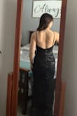 I had hoped this dress would be more form-fitting as shown on the model, but the fabric on the backside really does no favors for me. Unfortunately, I'll be returning this. Other than the fit, the dress is beautiful and light. I wouldn't have needed it hemmed had I decided to keep it. - Lindsay E.