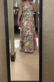 I'm 14 weeks pregnant and ordered a million dresses to find something that would be comfortable/ flattering/not invite too many questions about my changing shape. Normally, I am a 34C cup size and about 135lbs, and a small would have been perfect, but when I tried on the small, the waistband was quite snug and I had some problems with the zipper sticking. The medium was better in the waist, but the bodice was too large around my breasts. The straps were too long so it looked a little too blousy and wasn't flattering. As it's sold, I probably wouldn't have kept the medium, but I tailored the bodice quite a bit to straighten the neckline, added darts, shortened the straps to make it an empire waist, and also hemmed it. With the modifications I made, I love the dress and will be able to wear this dress to other formal events throughout pregnancy! The fabric is BEAUTIFUL and presses well. It was easy to get wrinkles out after traveling with it. I got many compliments on its summery vibe and colors! - Emma S.
