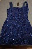 I purchased this dress to celebrate my birthday night out, I cannot explain how many people stopped me to compliment my dress. I had never felt so confident, pretty, and sexy all at the same time in one dress. 
A huge plus for me is that you can wear a bra with it and the straps are covered! 
I 100% recommend getting this dress and the blue can be a vibrant color or more body depending on the lighting, I am considering ordering the other colors as well! - Carston Z.