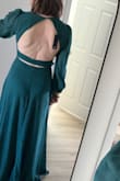 I love the flowy material and color of this dress! I'm usually between sizes (between small and medium), but the medium fits perfectly bc the material does not allow for stretch. The deep V in the front and open back give this otherwise modest dress some pop! - Miranda R.