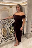 I recently wore this to a wedding. I loved it and felt gorgeous. The slit is perfect. I did wear generic Spanx that squash the muffin top area but didn't have shorts. The slit can be showy but I was cognizant of it and made sure I didn't flash anyone. I will definitely wear again. 

Super important!!! I did have it tailored! I had the fold down on the chest and arms stitched so it wouldn't ride up and then would constantly have to adjust it. Best decision I made. I didn't struggle with it all night! 

One downside and I read it in other reviews before I purchased it, is the side zipper does stab you a bit under the armpit. Next time I'd line with moleskin or something so I'm not irritated by it. - Jordan B.