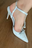 Looks just like the picture! Comfortable and looks very pretty in person. Wish the straps were stronger, but otherwise it's a cute pair of heels. - Niki L.