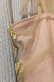 This falls like a sack on the top, and overall badly made. So many strings coming out. But really to emphasize the top portion...I could have cried at how unflattering it is because I filled out portions and the neckline cowled. So disappointed. - Allyson S.