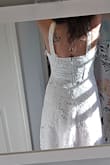 This dress is beautiful in person. It has a modest length, and fits perfectly. The waistline is incredibly flattering. - Cassaundra D.