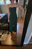 This romper is adorable. I love the colour (exactly what I was expecting with pictures), and the material is thick and double-lined. I'm 5'7 but have oddly long legs so the longer length fits, and it fits my torso okay! If anything the crotch area hung a little low on me which wasn't horrible since I didn't want that area tight anyways. The waist was in a good spot. My only complaint is the huge seam running up the front. Looks a little odd and I feel like it draws the eye...I will probably attempt to add a belt to avoid that. - Christine O.