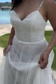 I recently got married and decided to take wedding pictures at our honeymoon. I tried on different Lulus dresses and found this one. It was perfect! It was flowy just how I wanted it and so pretty with all the details. The waist felt good for me. I didn't need to wear shapewear underneath. The downside is that the bust was a bit too big for me so I had to add adhesive bra pad inserts to fill up the cups. It was long for my height (I didn't wear shoes) but that wasn't an issue since I would just hold the skirt as I walked. Other than that, I was very happy with my dress for this photoshoot!! - Sina C.