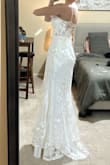 The floral appliqués have small clear sequins that sparkle and are so pretty. The cups are big enough (32DD) and the lace up back makes a really good fit. The way that the front tapered down from the cups to the top of the skirt makes my waist look so snatched. - Darla H.