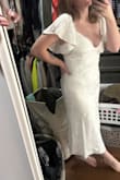 This squished my boobs and made them look flat but also put a crease in the middle of them. I loved how it hugged my figure, but could not get past the low cut awkwardness - Abby R.