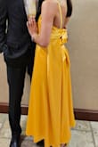 This is one of my favorite dresses I've bought from Lulus! The color was gorgeous, it was classy, and the bow was adorable. I wore this for my boyfriend's spring formal and received many compliments. The satin was soft, the dress fit perfectly, it wasn't too big, and the bow allowed me to adjust accordingly. - Jenna C.