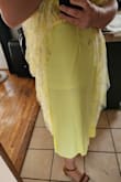 Let me start off by saying this dress is GORGEOUS. The color, the fabric, the fit, everything is beautiful. I've never worn yellow in my entire life, but this specific shade is absolutely beautiful. Definitely brighter than the pictures make it seem. I ordered an XL (34" waist, 38DD bust, 5'9", 210ish lbs) and it fits great. It's a bit snug, but I wouldn't size up. I can't fasten the metal hook by myself, but I was able to zip it up with no issues. My biggest complaint is the yellow slip underneath is very see through. You can see my nude colored Spanx, even through the mesh lining on top. It's not HORRIBLY noticeable, but I would be self-conscious about it, so I will be taking it somewhere to have an additional slip added to it. Also, I wore it around the house for 30ish minutes and was definitely readjusting the top frequently, but it's strapless and that's to be expected when you're larger chested like me. All in all, super happy I found this dress. I would order other colors in a heartbeat if they had them! - Sydney E.