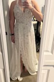 This dress is very see though. I loved loved loved the lace. It's a gorgeous dress but not for me for my wedding. Too sexy. I found the straps to be too thin and I didn't love how they cut through my back. I have a long torso and the bodysuit was perfect. I usually have bodysuits for that reason. Was also very long and would need to be hemmed. - Jacqueline W.